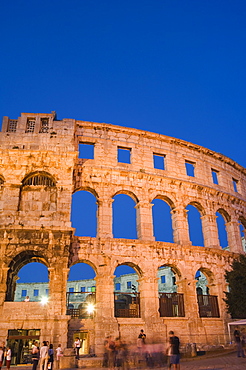 The 1st century Roman amphitheatre bathed in early evening light, Pula, Istria Coast, Croatia, Europe