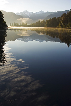 Lake Matheson reflecting a near perfect image of Mount Tasman and Aoraki (Mount Cook), 3754m, Australasia's highest mountain, Southern Alps, South Island New Zealand, Pacific