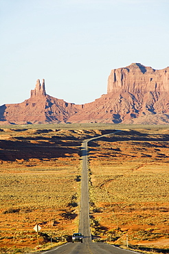 A long straight road leads into Monument Valley Navajo Tribal Park, Arizona, United States of America, North America