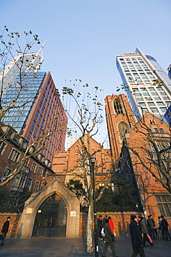 A Christian church among modern skyscrapers on Renmin Square, Puxi area, Shanghai, China, Asia