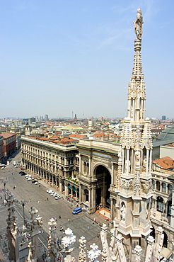 Rooftop spire of Duomo Cathedral and city, Milan, Lombardy, Italy, Europe