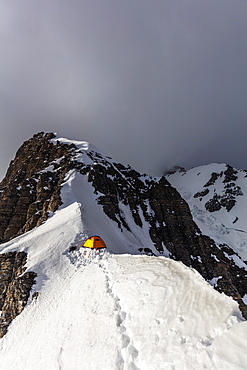 Tent at Camp 4 at 6100m on Peak Korzhenevskaya, 7105m, at sunset, Tajik National Park (Mountains of the Pamirs), UNESCO World Heritage Site, Tajikistan, Central Asia, Asia