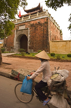 City wall gate, lady wearing conical hat, Hanoi, Northern Vietnam, Southeast Asia, Asia