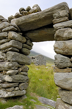 Deserted village at the base of Slievemore mountain, believed to have been abandoned during the great famine, Achill Island, County Mayo, Connacht, Republic of Ireland, Europe