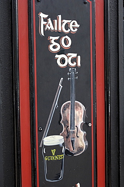 Typical Irish pub sign, Guinness and Fiddle, Lowery's pub, Clifden, Connemara, County Galway, Connacht, Republic of Ireland, Europe