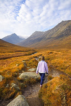 Woman walking in Glen Sannox, Isle of Arran, North Ayrshire, Scotland, United Kingdom, Europe