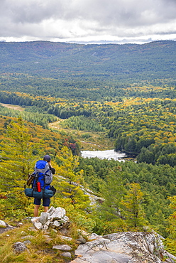 Hiker on La Cloche Silhouette Trail in Killarney Provincial Park, Ontario, Canada, North America