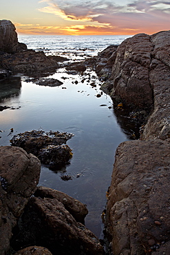 Sunset beyond the rocky coast, Elands Bay, South Africa, Africa