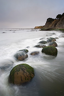 Boulders, known as Bowling Balls, in the surf, Bowling Ball Beach, California, United States of America, North America