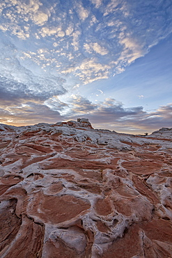 Clouds at dawn over salmon and white sandstone, White Pocket, Vermilion Cliffs National Monument, Arizona, United States of America, North America