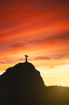 Statue of Christ the Redeemer at sunset, Corcovado, Rio de Janeiro, Brazil, South America