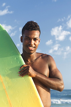 Young man with surfboard, Rio de Janeiro, Brazil, South America