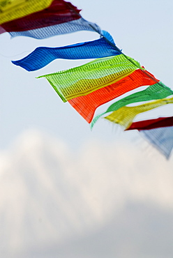 Prayer flags blowing in wind, Snow mountain, Tagong, Sichuan, China, Asia