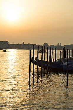 Gondolas moored at Campo della Salute on the Grand Canal at sunrise, Venice, UNESCO World Heritage Site, Veneto, Italy, Europe