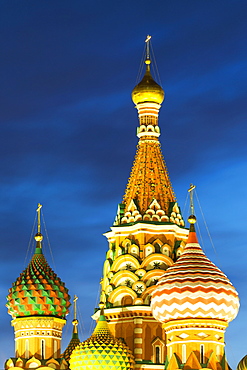 The onion domes of St. Basil's Cathedral in Red Square illuminated at night, UNESCO World Heritage Site, Moscow, Russia, Europe