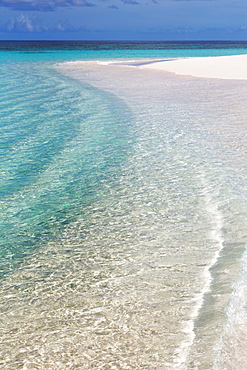 The crystal clear water of the Indian Ocean and a deserted beach on an island in the Maldives, Indian Ocean, Asia