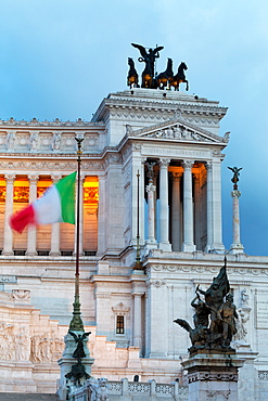 Italian flag in front of the Victor Emmanuel Monument at night, Rome, Lazio, Italy, Europe