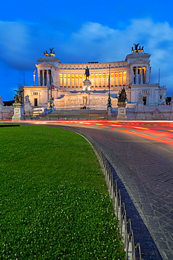 Moving traffic around Piazza Venezia with the Victor Emmanuel Monument at night, Rome, Lazio, Italy, Europe