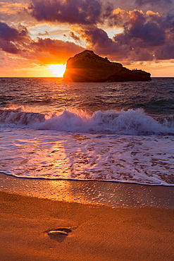 Sunset over Roche Ronde rock off the coast of Biarritz, Pyrenees Atlantiques, Aquitaine, France, Europe