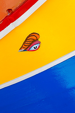 Detail of traditional brightly painted fishing boat in the harbour at Marsaxlokk, Malta, Mediterranean, Europe