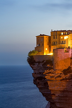 Night view of the Citadel and old town of Bonifacio perched on rugged cliffs, Bonifacio, Corsica, France, Mediterranean, Europe