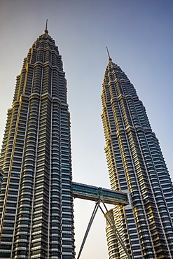 The iconic 88 floor Petronas Twin Towers, connected by a skybridge, designed by Cesar Pelli, in the capital city of Kuala Lumpur, Malaysia, Southeast Asia, Asia