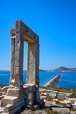 The Porta Gateway, part of the unfinished Temple of Apollo, Naxos Town, Naxos, the Cyclades, Aegean Sea, with Paros beyond, Greek Islands, Greece, Europe