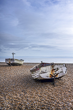 Old traditional fishing boats on the shingle beach at Aldeburgh, in the county of Suffolk, East Anglia.