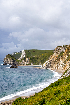 A beach under the high cliffs on the Dorset Jurassic Coast World Heritage site.