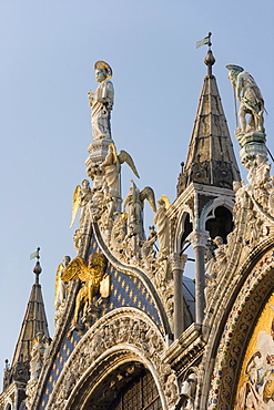 St. Mark and angels, detail of the facade of Basilica di San Marco (St. Mark's Basilica), St. Mark's Square, Venice, UNESCO World Heritage Site, Veneto, Italy, Europe