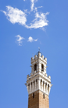 The bell tower of Palazzo Pubblico with cloud, Sienna, Tuscany, Italy