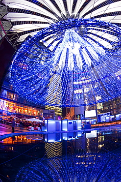 Futuristic design of the Sony Center in Potsdamer Platz, illuminated at Christmas, Berlin, Germany, Europe