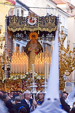 Religious float being carried through the streets during Semana Santa (Holy Week) celebrations, Malaga, Andalucia, Spain, Europe