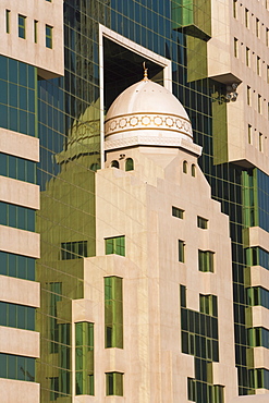 Ministry of Education building featuring a mosque dome set in the glass frontage, Doha, Qatar, Middle East