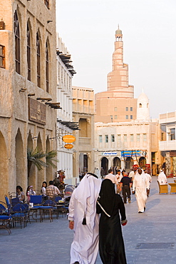 The restored Souq Waqif looking towards the spiral mosque of the Kassem Darwish Fakhroo Islamic Centre based on the Great Mosque in Samarra in Iraq, Doha, Qatar, Middle East