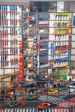 Street scene reflections at a busy Shibuya intersection, Tokyo, Honshu, Japan, Asia