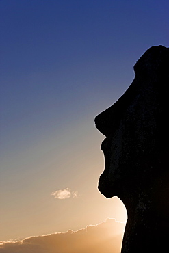 Silhouette of a lone monolithic giant stone Moai statue at Tongariki, Rapa Nui (Easter Island), UNESCO World Heritage Site, Chile, South America