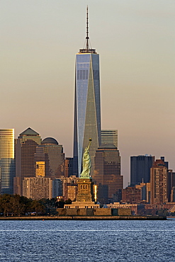 Statue of Liberty, One World Trade Center and Downtown Manhattan across the Hudson River, New York, United States of America, North America