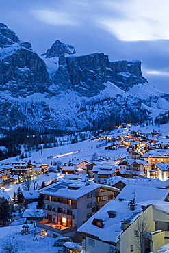 The village of Colfosco in Badia, 1645m, and Sella Massif range of mountains under winter snow, Dolomites, South Tirol, Trentino-Alto Adige, Italy, Europe