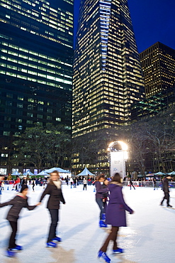 Ice skating rink in Bryant Park at Christmas, Manhattan, New York City, New York, United States of America, North America