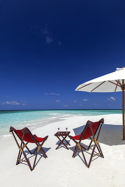 Martini and chairs on the beach, Maldives, Indian Ocean, Asia