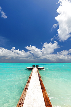 Jetty and chairs overlooking sea, The Maldives, Indian Ocean, Asia