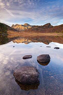 The Langdale Pikes mountains reflected in the mirror still water of Blea Tarn in autumn, Lake District National Park, UNESCO World Heritage Site, Cumbria, England, United Kingdom, Europe