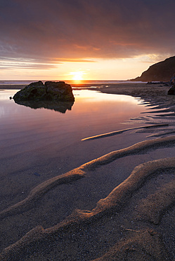 Beautiful sunset on a deserted Holywell Beach, Cornwall, England, United Kingdom, Europe