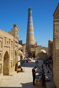 Shopping Street, Islam Khoja Minaret in the background, Ichon Qala (Itchan Kala), UNESCO World Heritage Site, Khiva, Uzbekistan, Central Asia, Asia