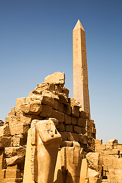 Statues in foreground, Obelisk of Thutmose I, Karnak Temple Complex, UNESCO World Heritage Site, Luxor, Egypt, North Africa, Africa