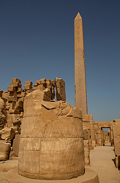 Column Base, Obelisk of Thutmose I in the background, Karnak Temple Complex, UNESCO World Heritage Site, Luxor, Egypt, North Africa, Africa