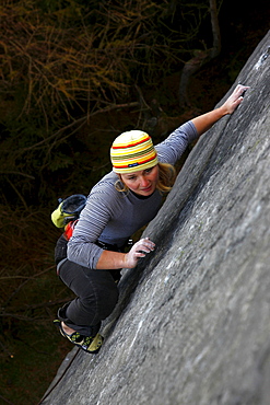 A climber on a difficult route on the cliffs known as The Roaches, Staffordshire, Peak District, England, United Kingdom, Europe