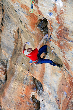 A climber scales cliffs near San Vito Lo Capo, northwest Sicily, Italy, Europe