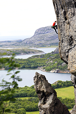 A climber scales a difficult route in the Hanshallaren Cave, Flatanger, Norway, Scandinavia, Europe